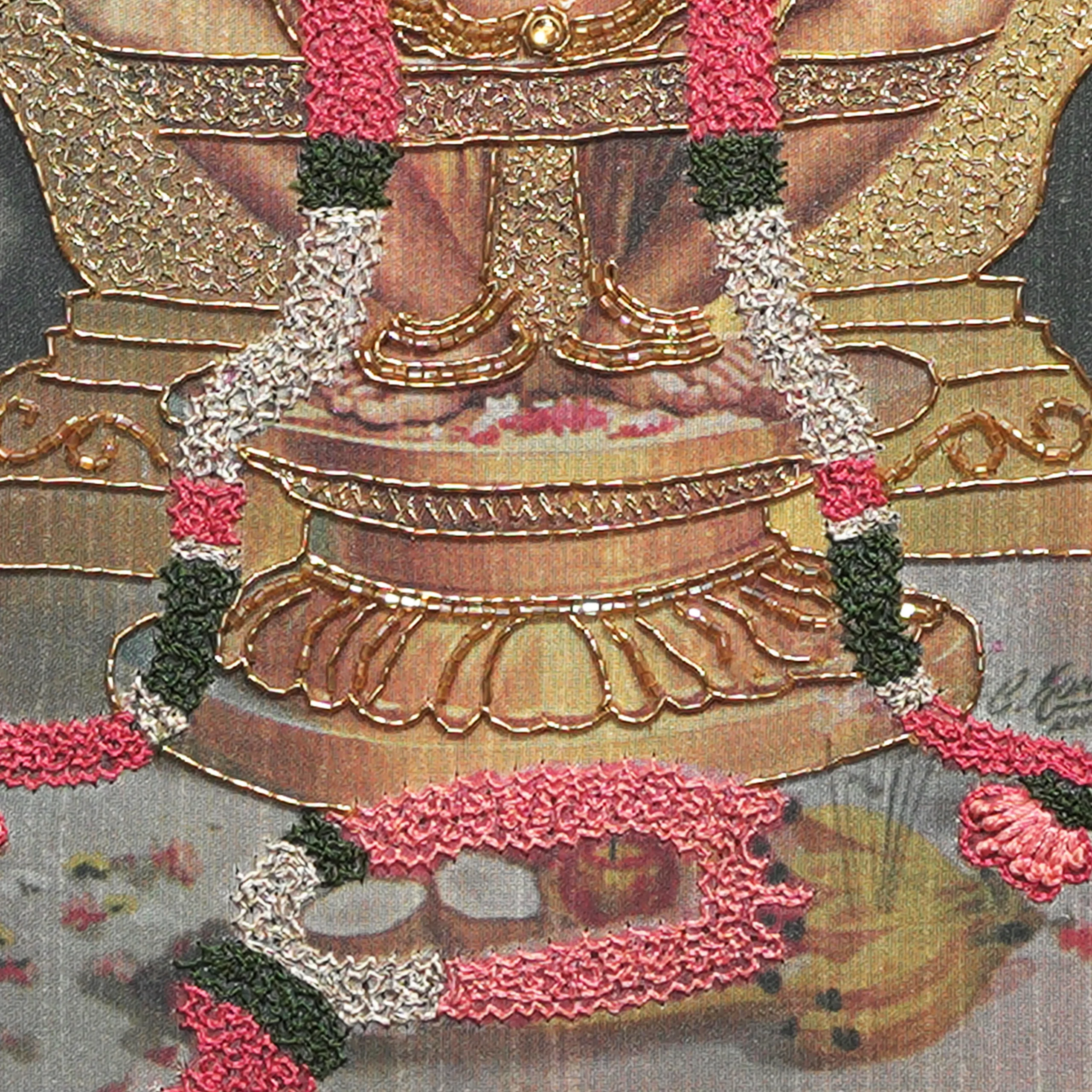 Close-up of Lord Ayyappan lower body embroidery showing intricate Zardoshi threadwork on raw silk