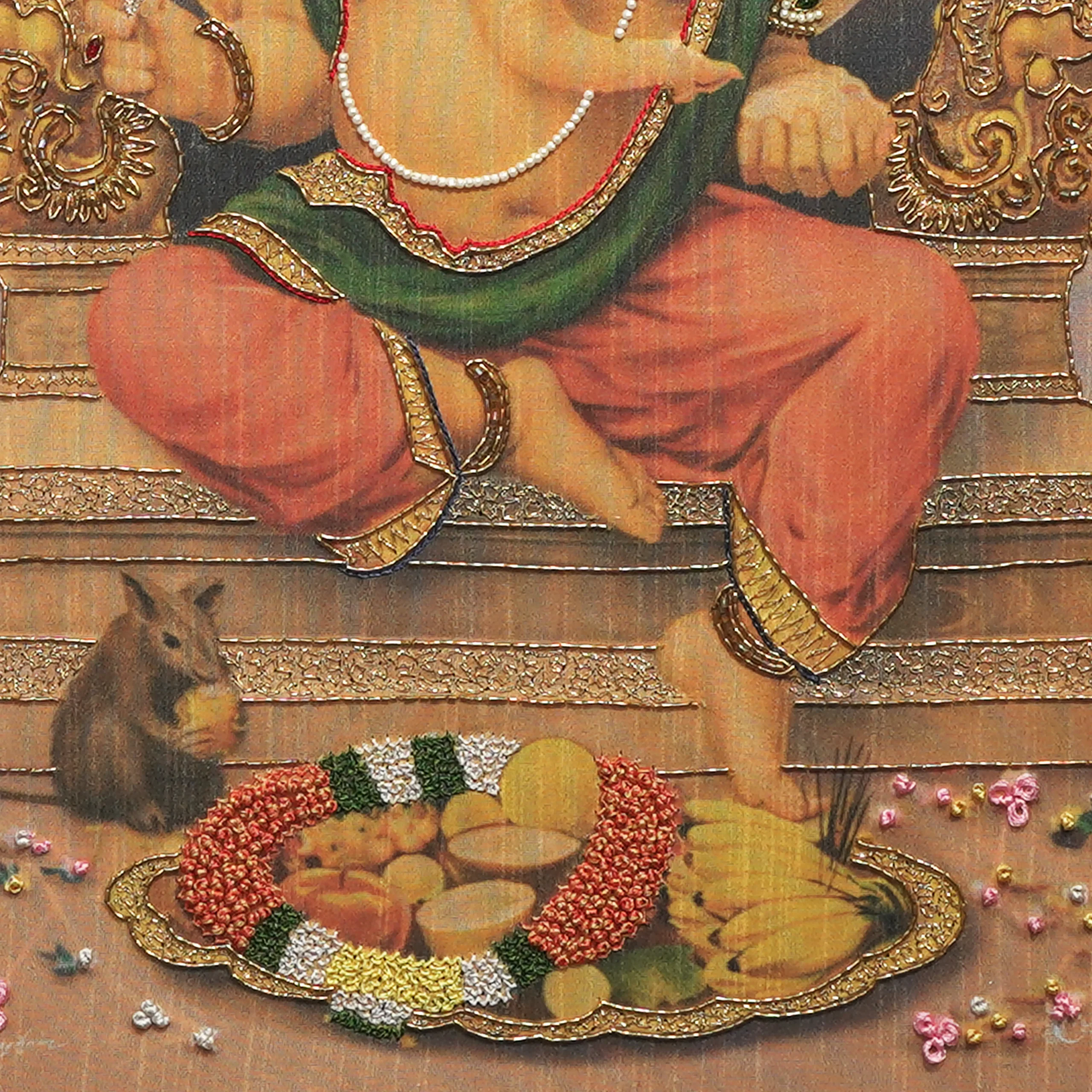 Close-up of Lord Ganapathy lower body embroidery showing intricate Zardoshi threadwork on raw silk