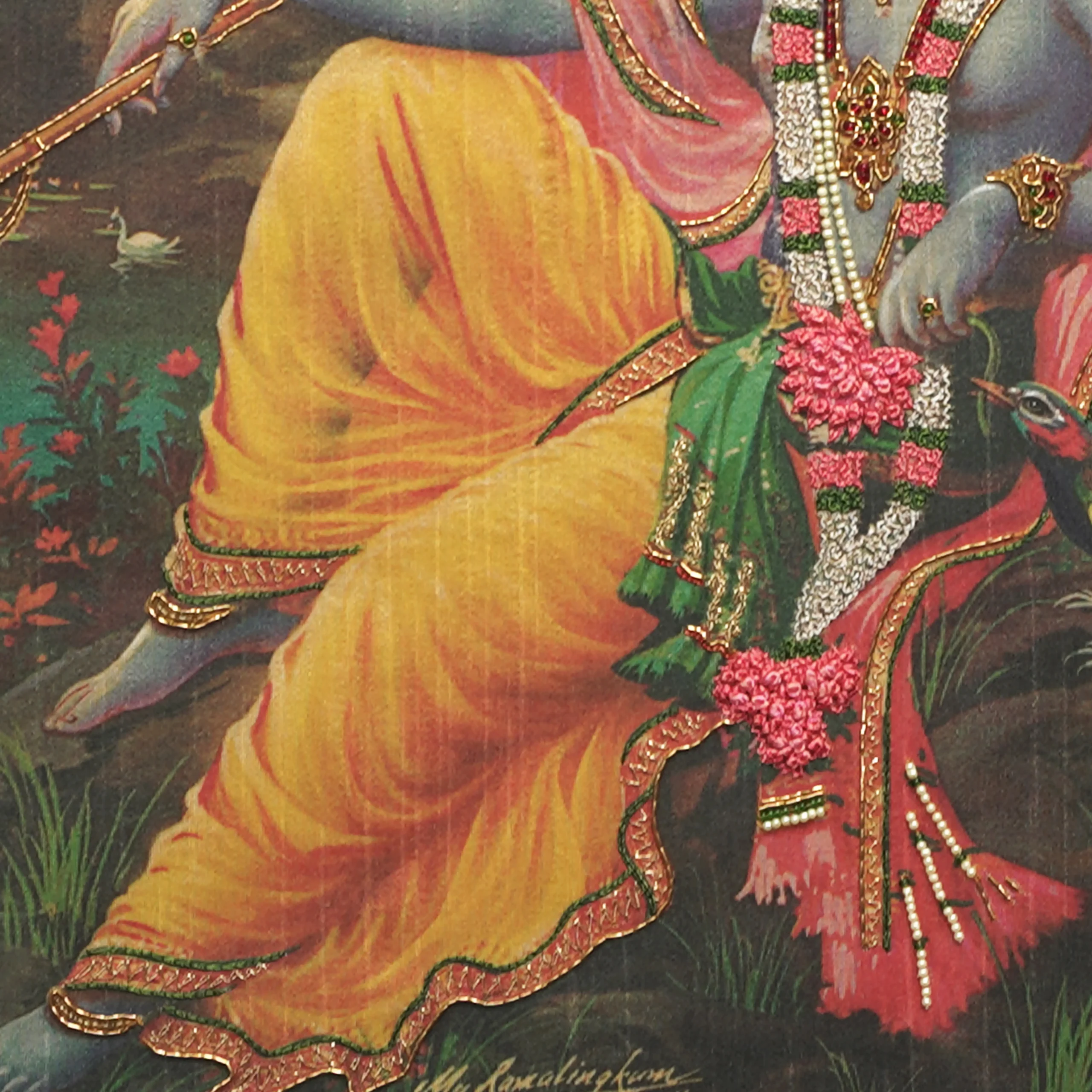 Close-up of Lord Krishna lower body embroidery showing intricate Zardoshi threadwork on raw silk