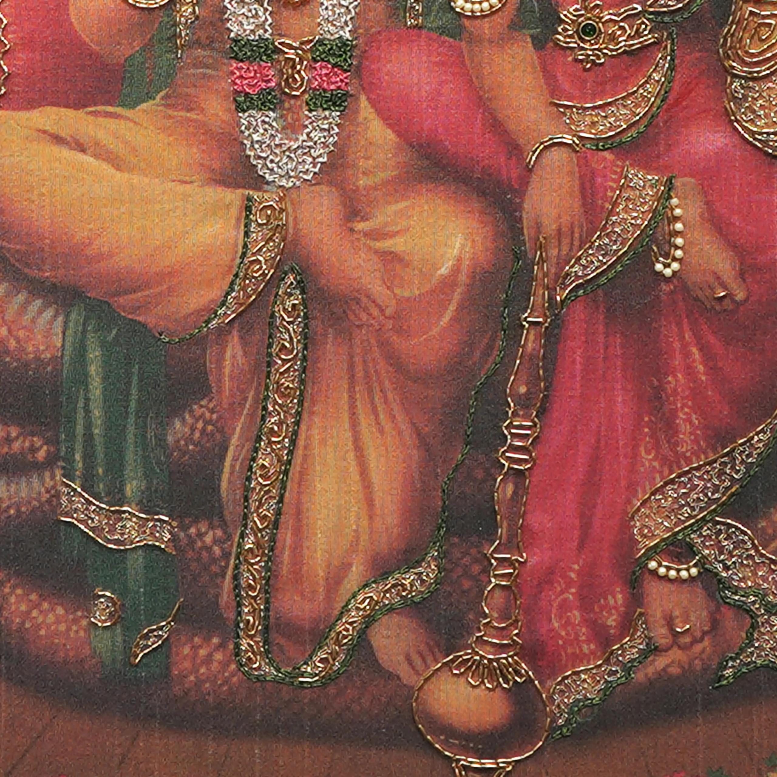 Close-up of Lord Lakshmi Narayana lower body embroidery showing intricate Zardoshi threadwork on raw silk