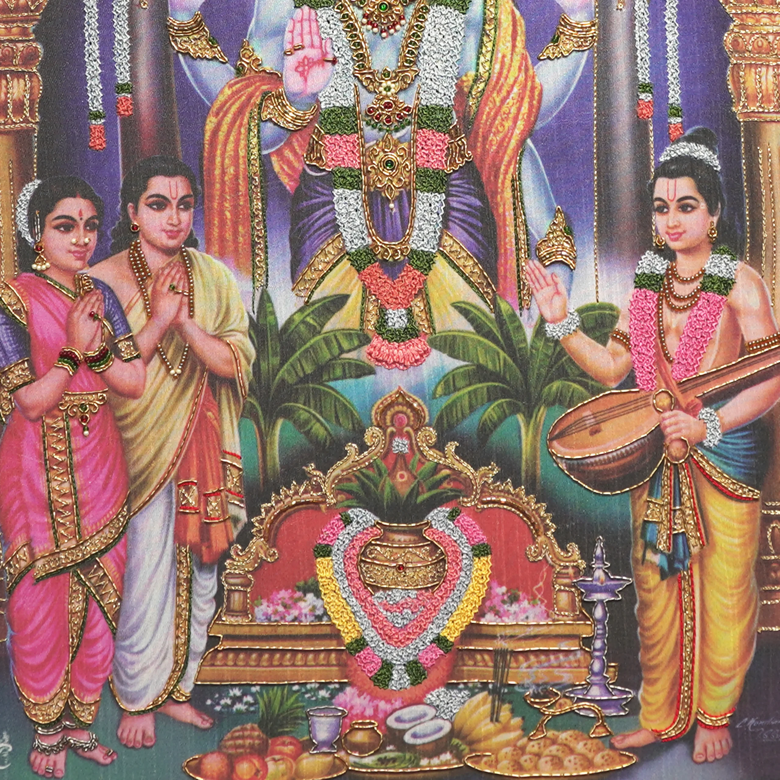 Close-up of Lord Sathyanarayana lower body embroidery showing intricate Zardoshi threadwork on raw silk