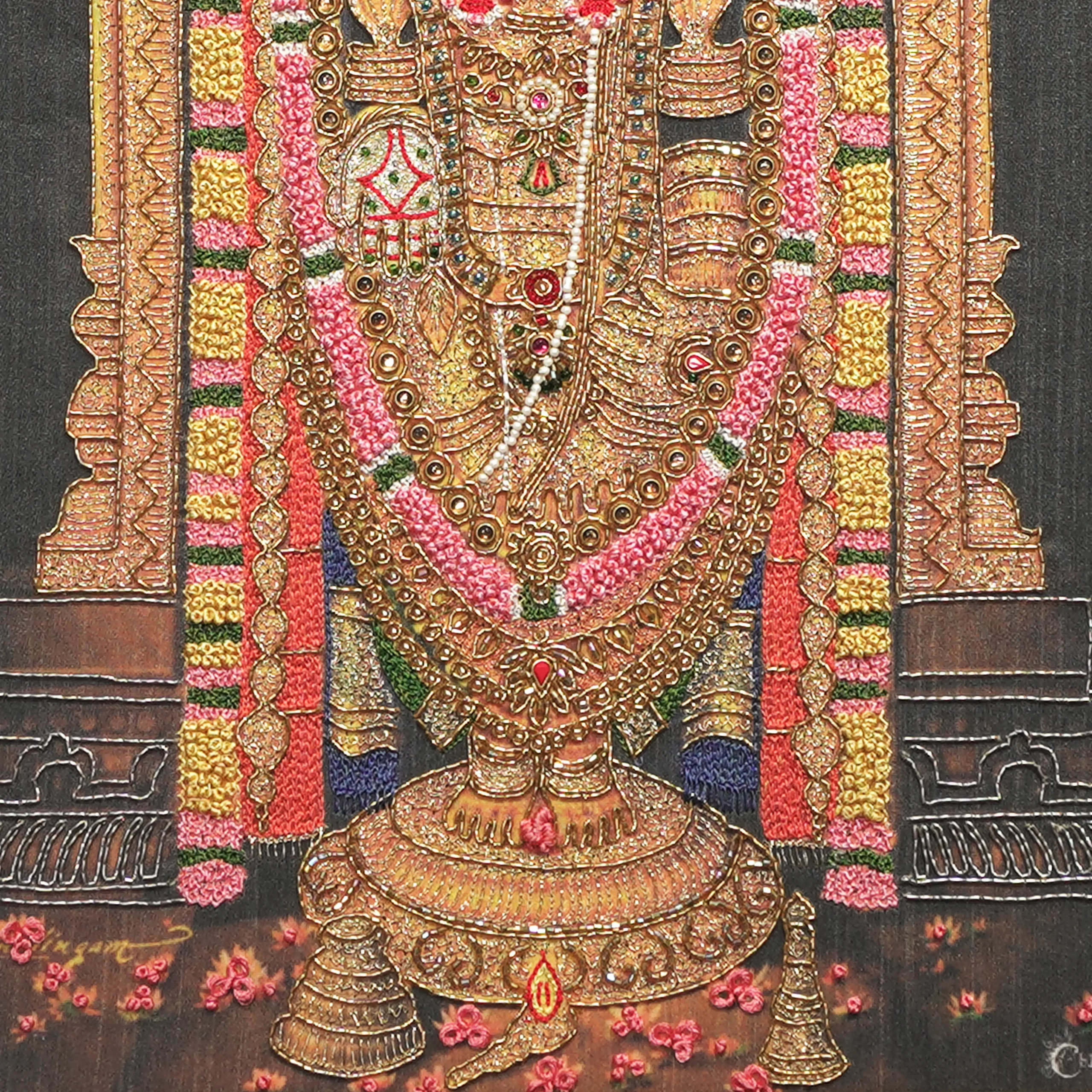Close-up of Lord Venkatachalapathy lower body embroidery showing intricate Zardoshi threadwork on raw silk