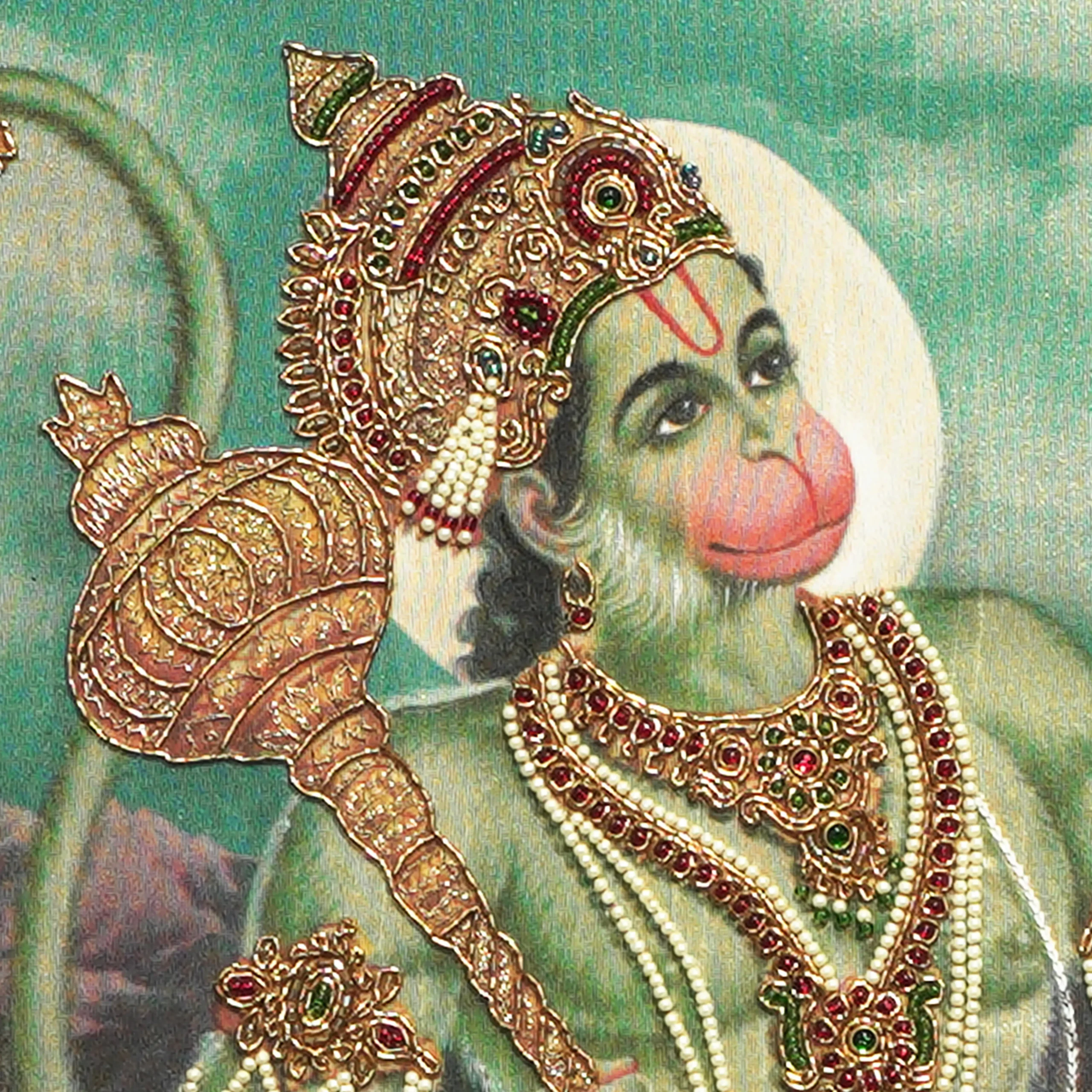 Close-up of Sri Anjaneya face and crown detail with handcrafted Ari and Zardoshi embroidery on raw silk
