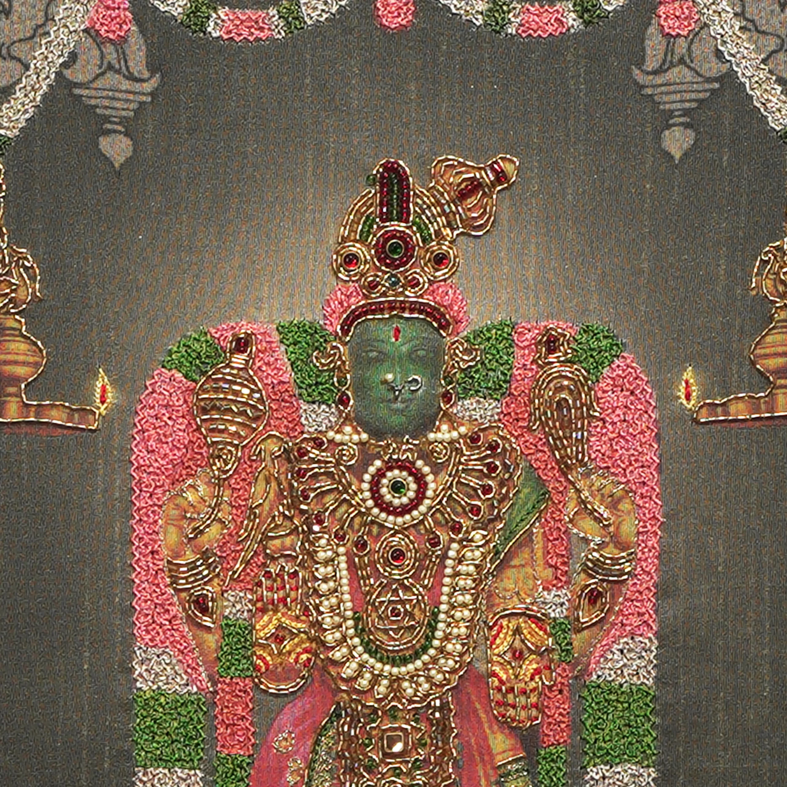 Close-up of Sri Karpagambal face and crown detail with handcrafted Ari and Zardoshi embroidery on raw silk