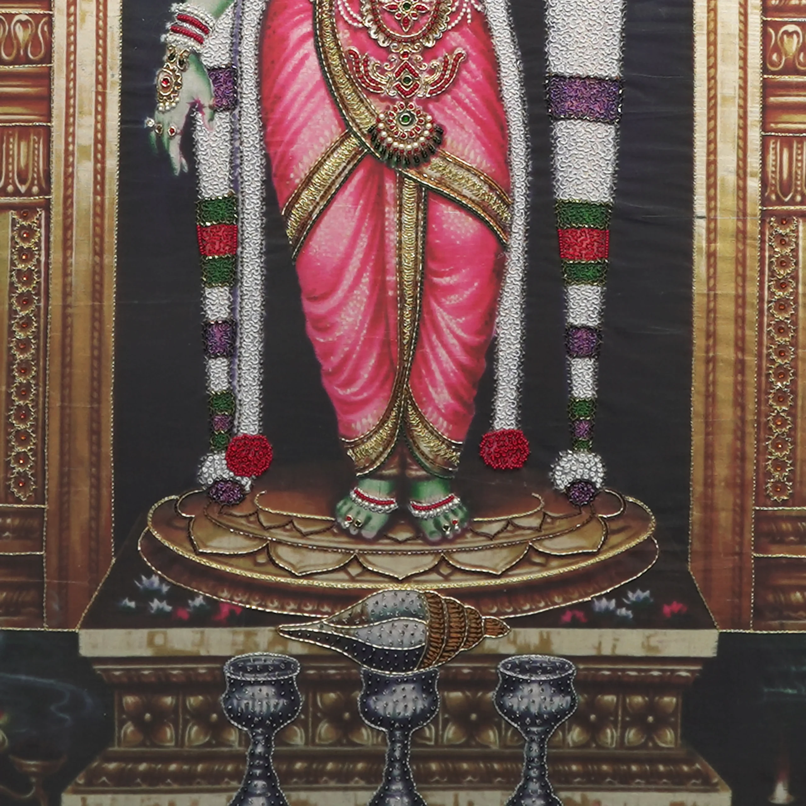 Close-up of Sri Meenakshi lower body embroidery showing intricate Zardoshi threadwork on raw silk