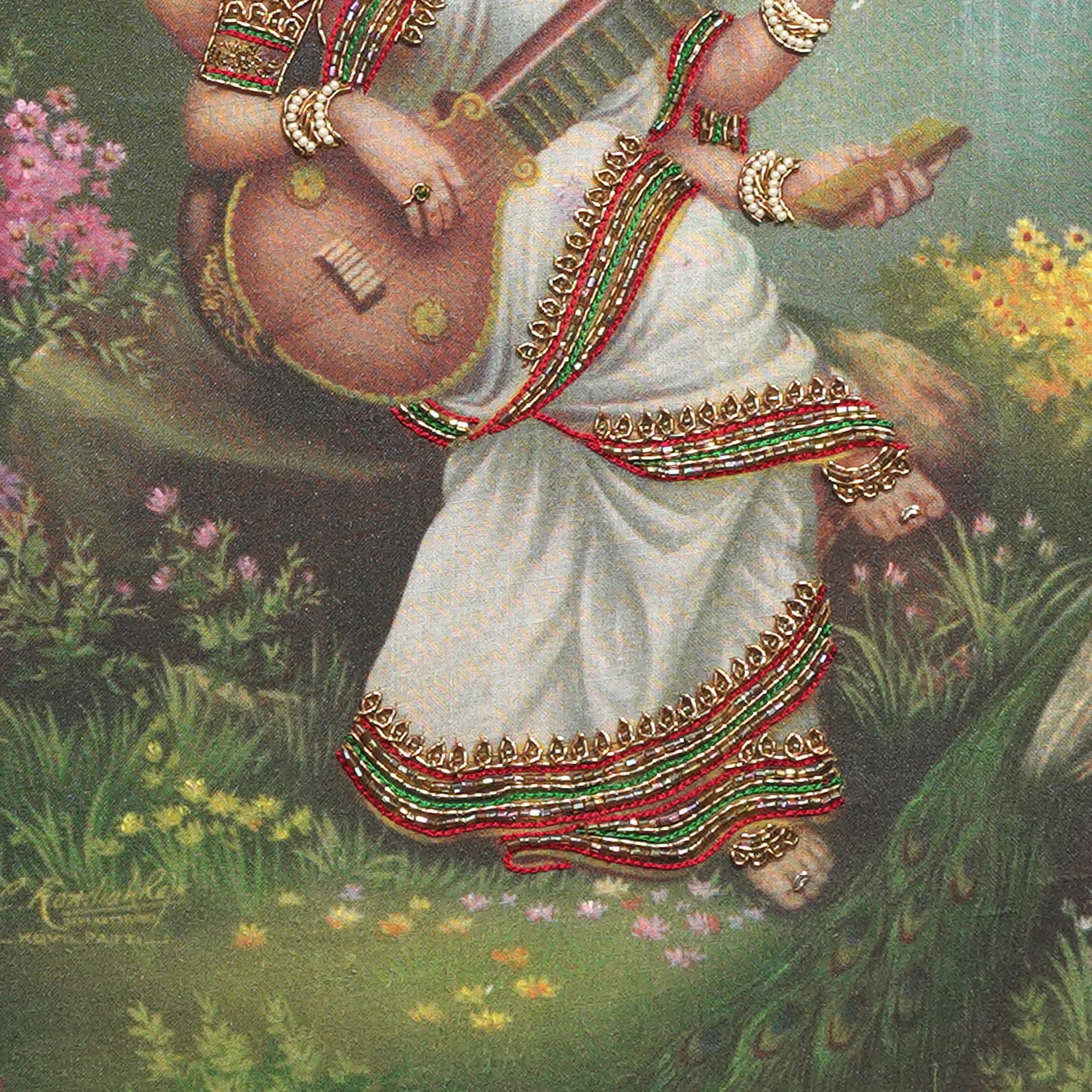 Close-up of Sri Saraswathi lower body embroidery showing intricate Zardoshi threadwork on raw silk